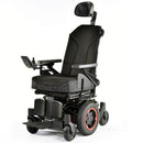 Image shows Q300M Mini powerchair with red accents