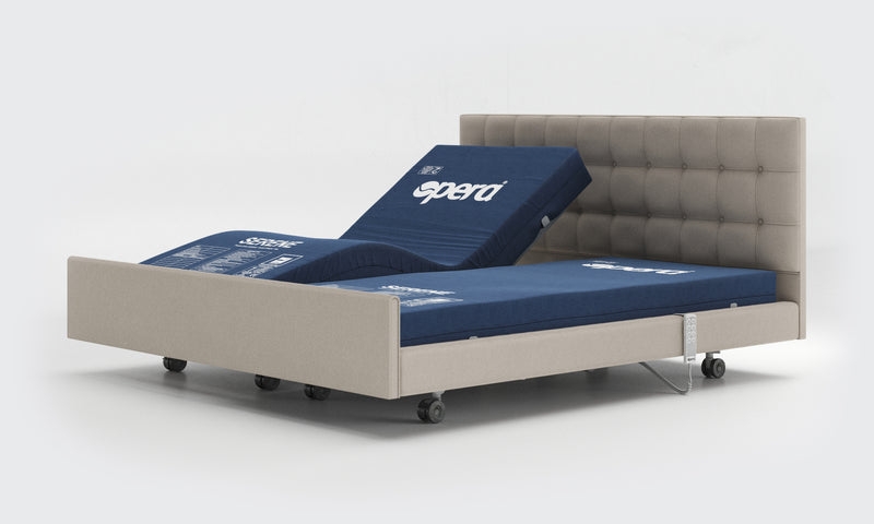 Opera Signtature Comfort Dual Profiling Adjustable Care bed. Bed is undressed showing independent mattress positions.