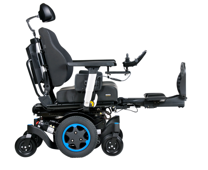 Q300M Mini Powerchair side view. Flip back armrests, elevated foot plate