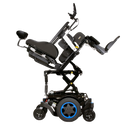 Image shows Q300M Mini side profile elevated at full height with the seat position reclined. Shown with Blue accents and blue patterned shrouds
