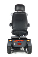 Black electric wheelchair on a white background. Rear View